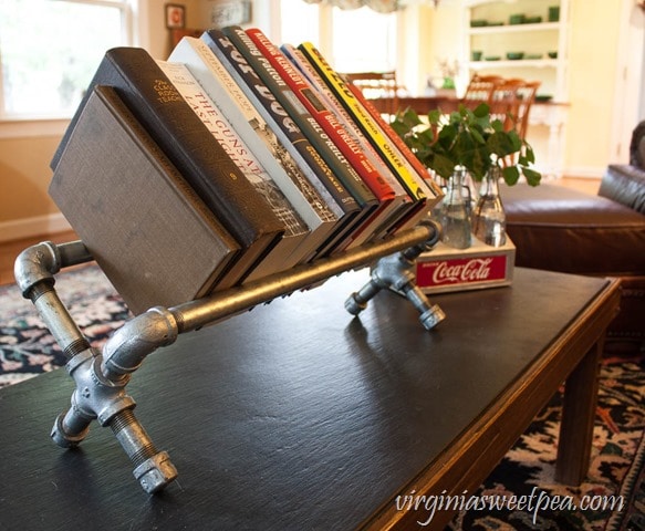 DIY Industrial Pipe Bookshelf - This bookshelf is easy to make and is perfect for displaying books. Get the tutorial at virginiasweetpea.com