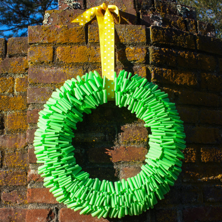 Make a wreath using crepe paper, sewing pins, and a styrofoam wreath form.