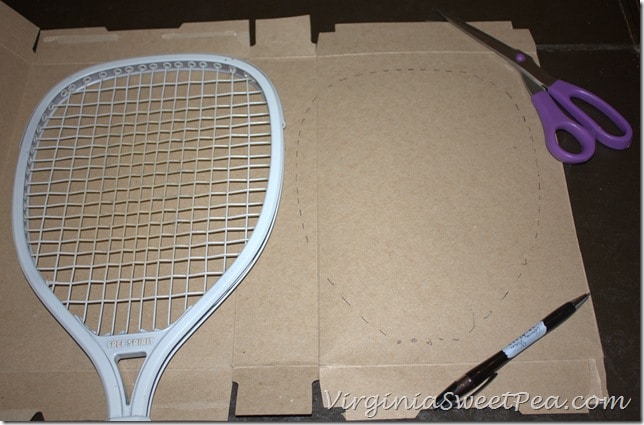  Poinsettia Wreath made using an upcycled Racketball Racket - Get the step-by-step tutorial to make your own Christmas wreath using an old racketball racket.