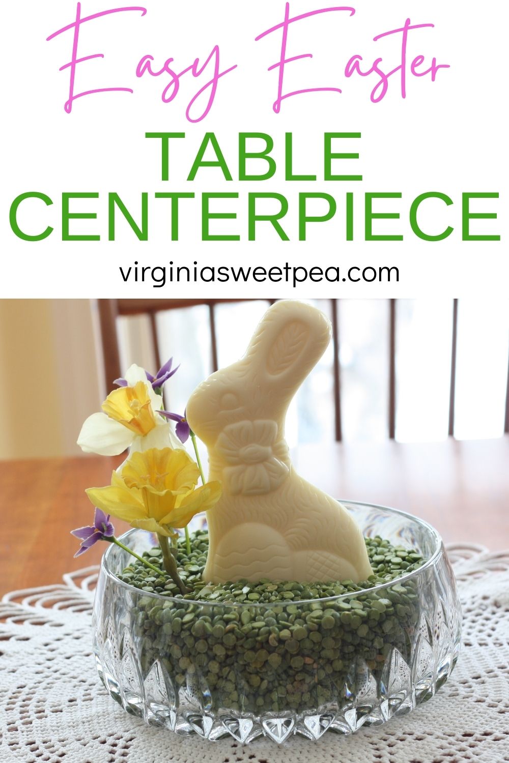 Easter centerpiece with a glass bowl filled with dried green split peas, a white chocolate rabbit, and faux daffodils.