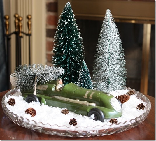 Vintage Toy Car carrying a Christmas tree