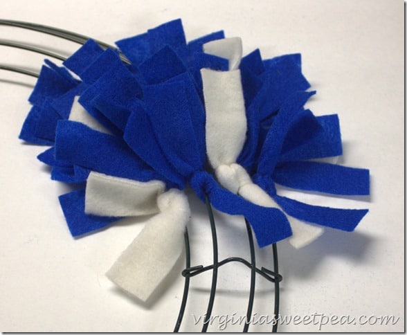 Make an easy Patriotic Wreath from fleece strips and a wire wreath form.  This is perfect for July 4 and other patriotic holidays.  virginiasweetpea.com