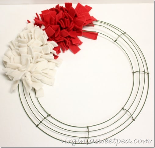 Make an easy Patriotic Wreath from fleece strips and a wire wreath form.  This is perfect for July 4 and other patriotic holidays.  virginiasweetpea.com