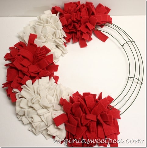 Make an easy Patriotic Wreath from fleece strips and a wire wreath form.  This is perfect for July 4 and other patriotic holidays.  virginiasweetpea.com