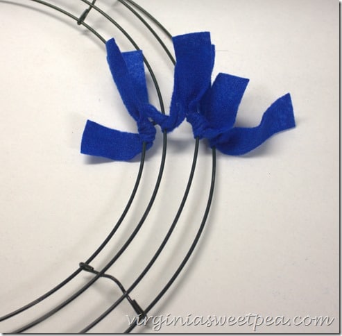 Make an easy Patriotic Wreath from fleece strips and a wire wreath form.  This is perfect for July 4 and other patriotic holidays.  virginiasweetpea.com