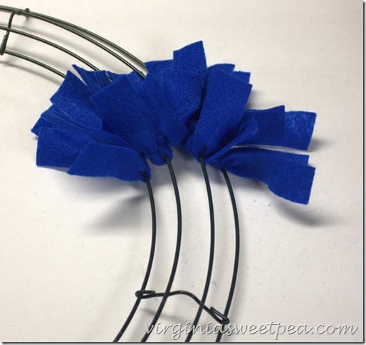 Make an easy Patriotic Wreath from fleece strips and a wire wreath form.  This is perfect for July 4 and other patriotic holidays.  virginiasweetpea.com