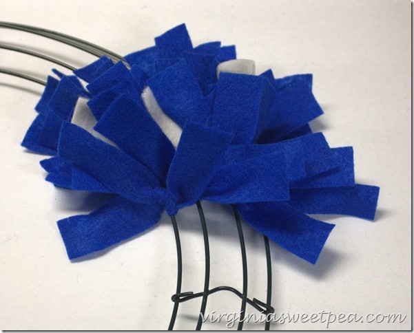 Make an easy Patriotic Wreath from fleece strips and a wire wreath form.  This is perfect for July 4 and other patriotic holidays.  virginiasweetpea.com