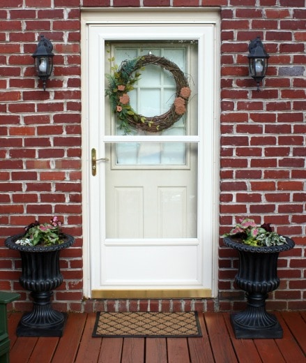 Balsam Hill Tuscan Urns on the deck filled with flowers. These are so pretty and look great from the street.