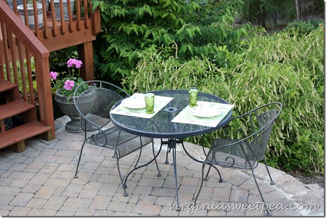 A yard sale patio set makes a nice place to dine.