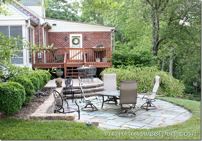 Patio and deck ready for summer.  Furniture was cleaned, the deck wa stained, and flowers were planted.