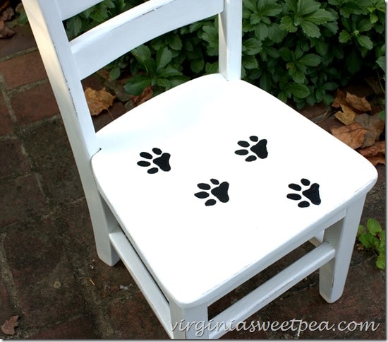 Painted paw prints on this child's chair are so cute! virginiasweetpea.com