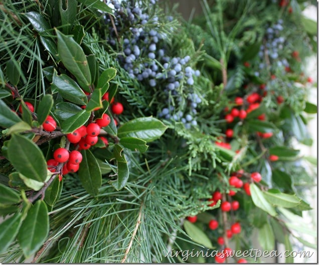 Christmas Wreath made with fresh greenery including Holly and Cedar.  This smells wonderful!