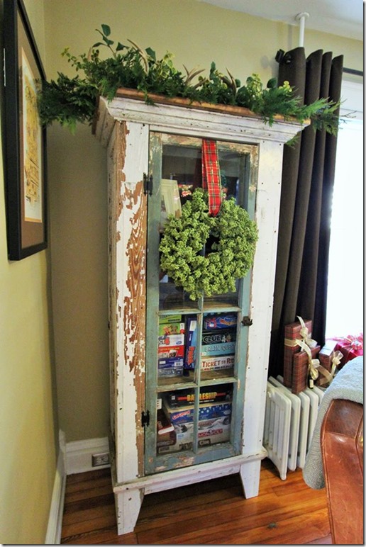 Store children's games in a vintage cabinet.