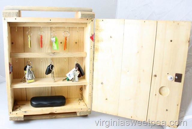 Use an ammunition crate to make a hanging key organizer with a door. This could also be used for storing craft supplies, nail polish, or small tools. Get the step-by-step tutorial to make one for your home. #repurpose #upcycle #repurposeproject #upcycleproject #ammunitioncrate