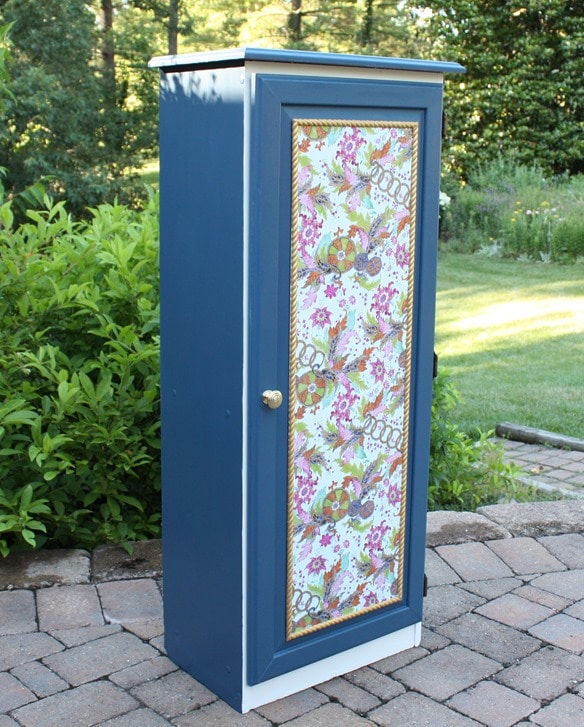 A Sauder cabinet gets a makeover with paint and a pretty decoupaged paper door front. Get the details at virginiasweetpea.com.