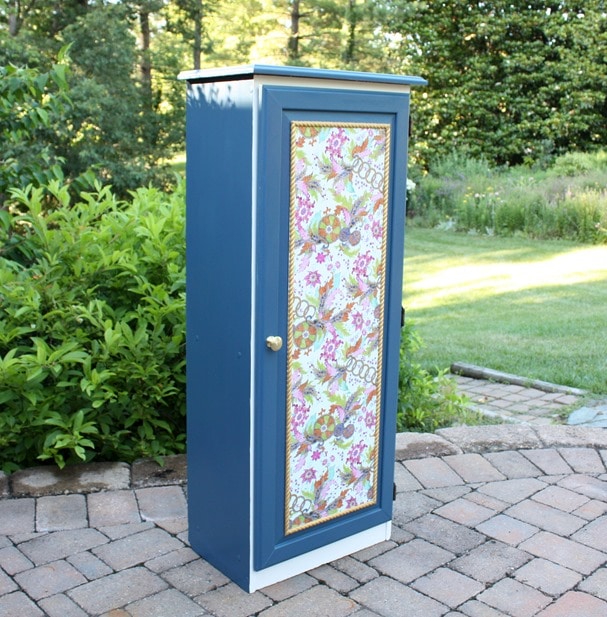 A Sauder cabinet gets a makeover with paint rope trim, and decoupaged gift wrap. Get the details at virginiasweetpea.com