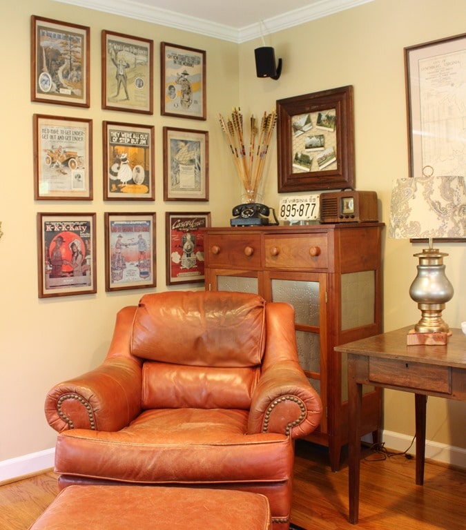 Framed vintage sheet music display with other antiques.