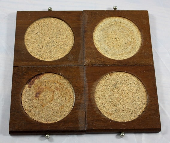 Goodwill coasters are glued together to make a trivet for hot dishes.
