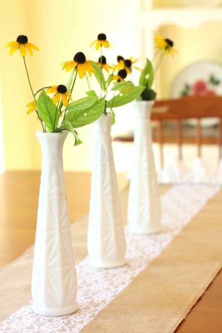 Make an easy burlap and lace table runner embellished with a sweet ruffle. This project can be made in under 30 minutes! virginiasweetpea.com