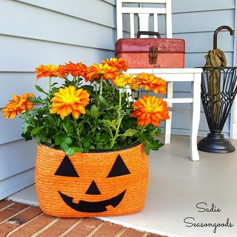 8_orange_black_straw_tote_bag_to_be_repurposed_as_Halloween_pumpkin_jack_o-lantern_porch_planter_for_Pele_mums_by_Sadie_Seasongoods