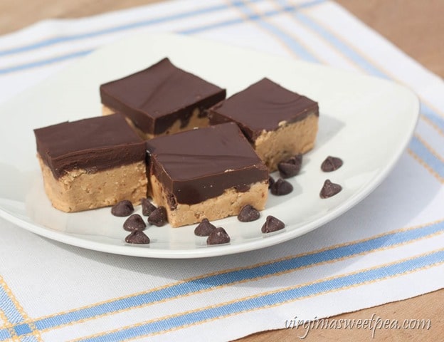 Peanut butter squares made with pretzel crumbs and topped with melted chocolate