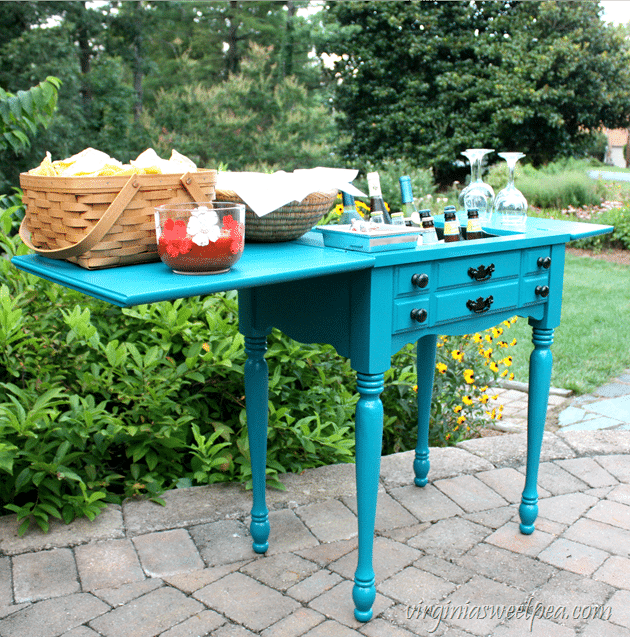 A sewing cabinet found on the side of the road is transformed into an outdoor bar. Get the step-by-step tutorial to make one for your home. #repurpose #upcycle #upcycledproject #repurposeidea #diy #diyproject