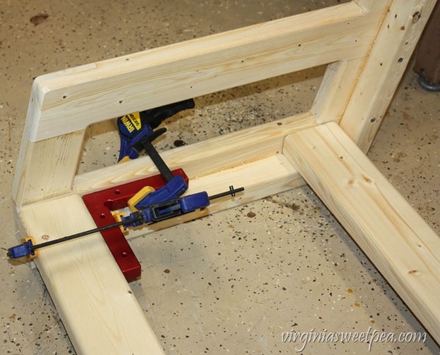 How to Make a DIY 2x4 Porch Swing - Get the step-by-step directions at virginiasweetpea.com