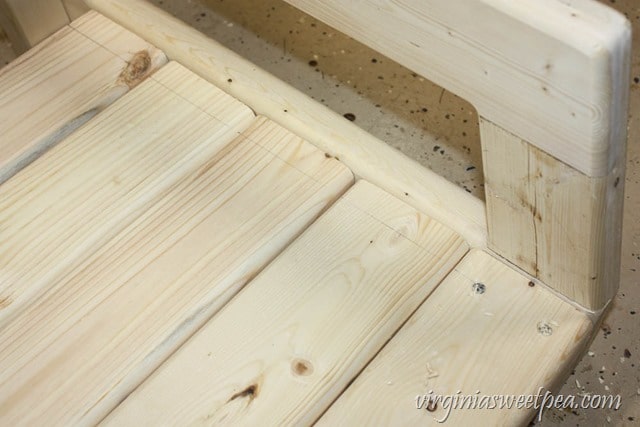 How to Make a DIY 2x4 Porch Swing - Get the step-by-step directions at virginiasweetpea.com