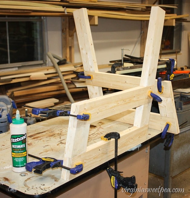 How to Make a DIY 2x4 Porch Swing - Get the step-by-step directions at virginiasweetpea.com