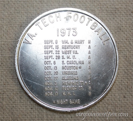 1973 Virginia Tech Student Association Coin advertising the VT Football Schedule - virginiasweetpea.com