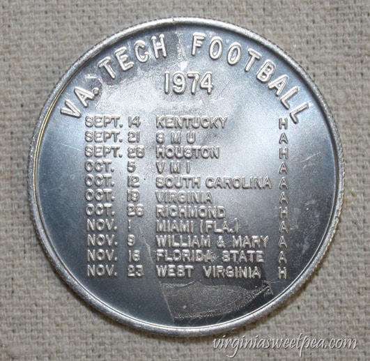 1974 Virginia Tech Student Association Coin advertising the VT Football Schedule - virginiasweetpea.com