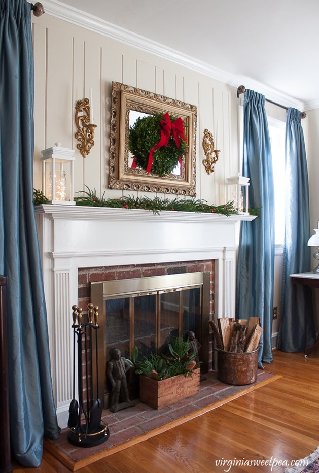 Christmas in the Living Room - Mantel Decorated with DIY Lanterns. Get the step-by step tutorial to make these at virginiasweetpea.com.