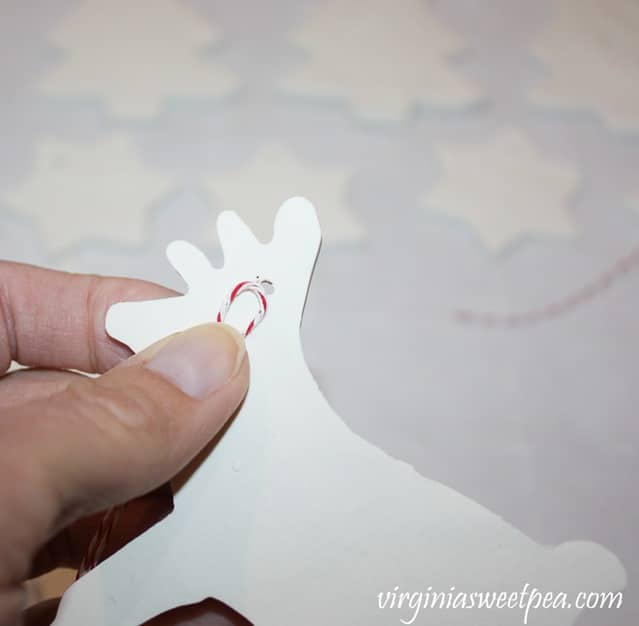 Adding a twine hanger to a Christmas ornament