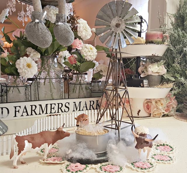 Create a winter farmhouse vignette with silver and white.