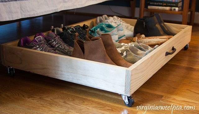 drawer on wheels used to store shoes under the bed