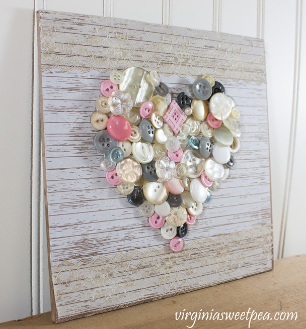 Create art with buttons. This button heart is an easy craft that makes a perfect Valentine's Day decoration. #buttonheart #buttoncraft #buttons #valentinesdaycraft