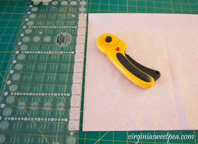 How to Make a Farmhouse Style Rag Wreath - Cut fabric with a quilting square and rotary cutter.