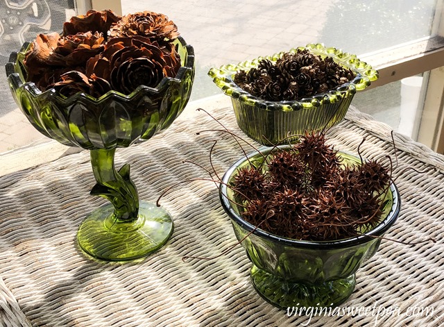 St. Patrick's Day Vignette - Pine Cones and Sweet Gum Balls in Vintage Green Vases - virginiasweetpea.com #stpatricksday #stpatricksdaydecor