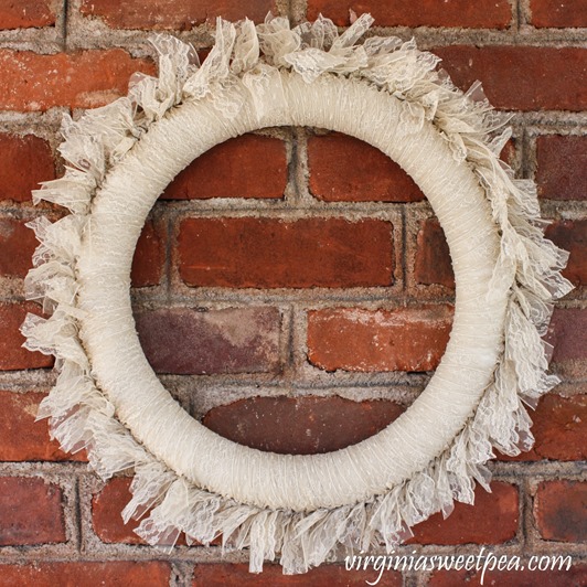 DIY Lace Wreath - This pretty wreath can be enjoyed as is or embellished for use in a particular season. virginiasweetpea.com #wreath #lacewreath #lace