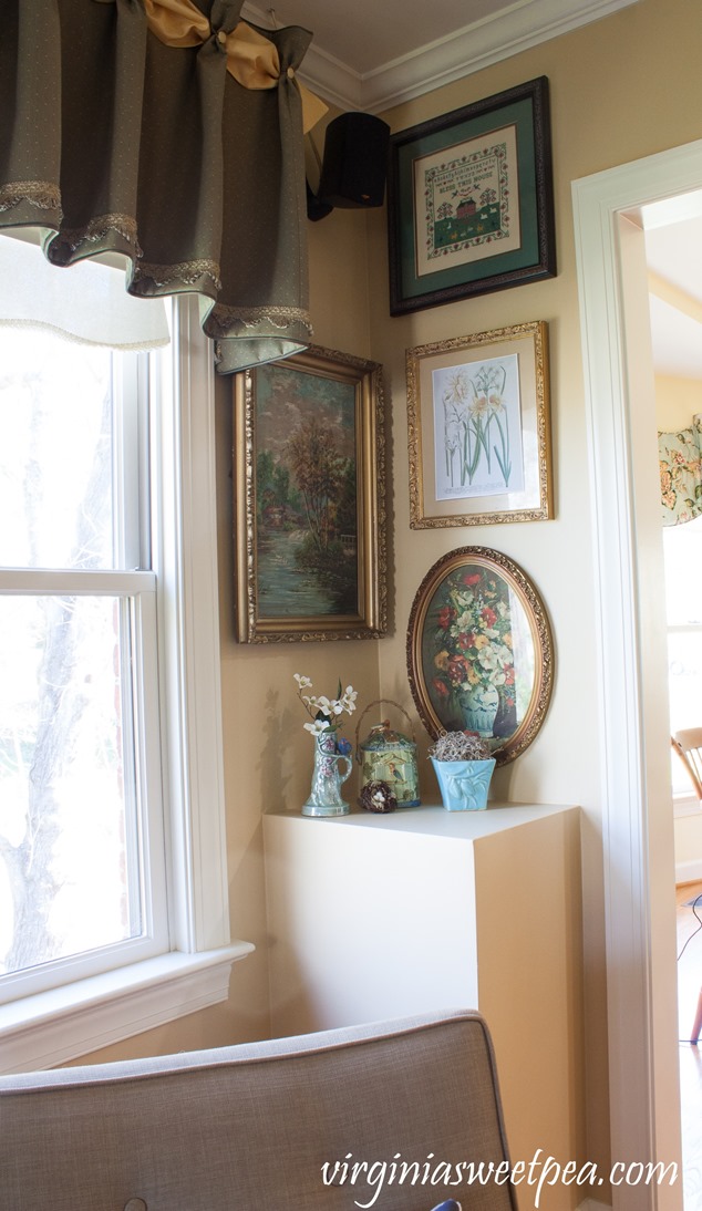 Living Room Corner decorated for spring with floral prints, vintage bird decor, and a McCoy vase. #springdecorating #vintagedecor #hometour #springhometour #styledforspring #vintagedecor