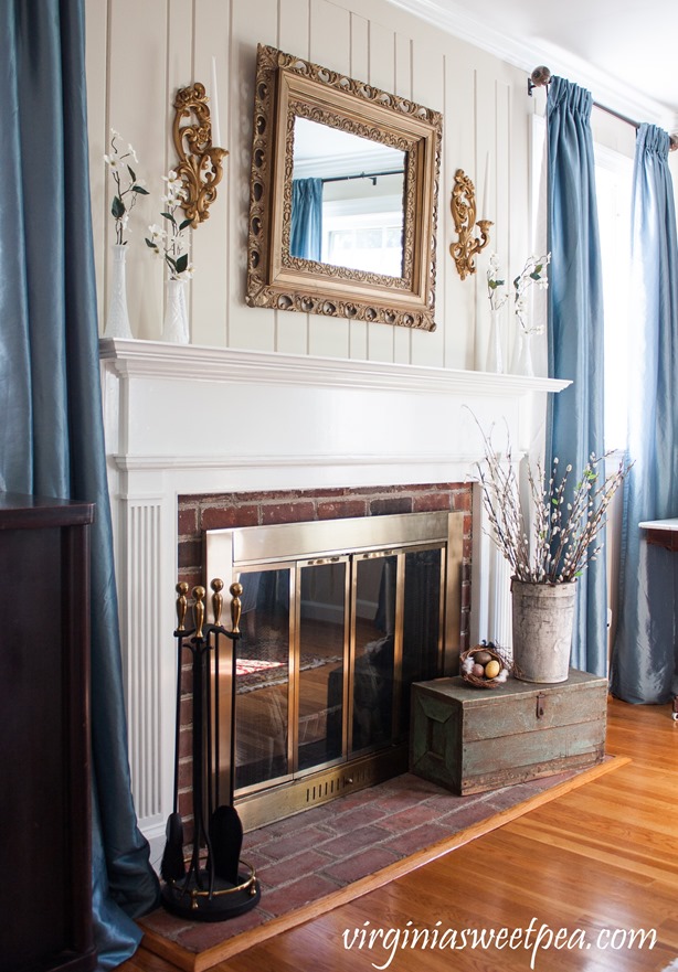 Living room mantel decorated for spring using vintage decor. virginiasweetpea.com #springdecorating #vintagedecor #springmantel #styledforspring #vintagedecor