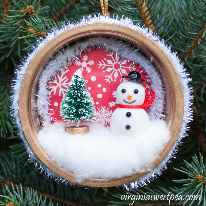 Handmade Winter Wonderland Christmas Ornament - You'll never guess what was upcycled to make this pretty ornament! #christmascraft #handmadechristmas #decoratethetree #christmastreeornaments #christmastreeideas