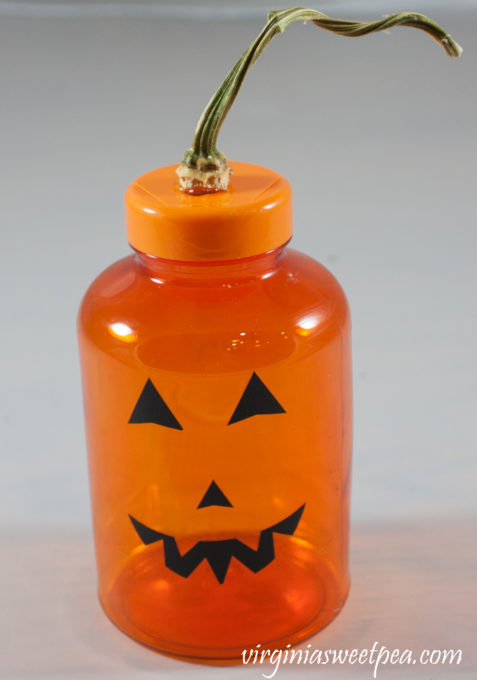 Jack-o-Lantern made using an orange medicine bottle