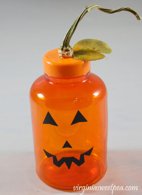 Jack-o-Lantern made using an orange medicine bottle