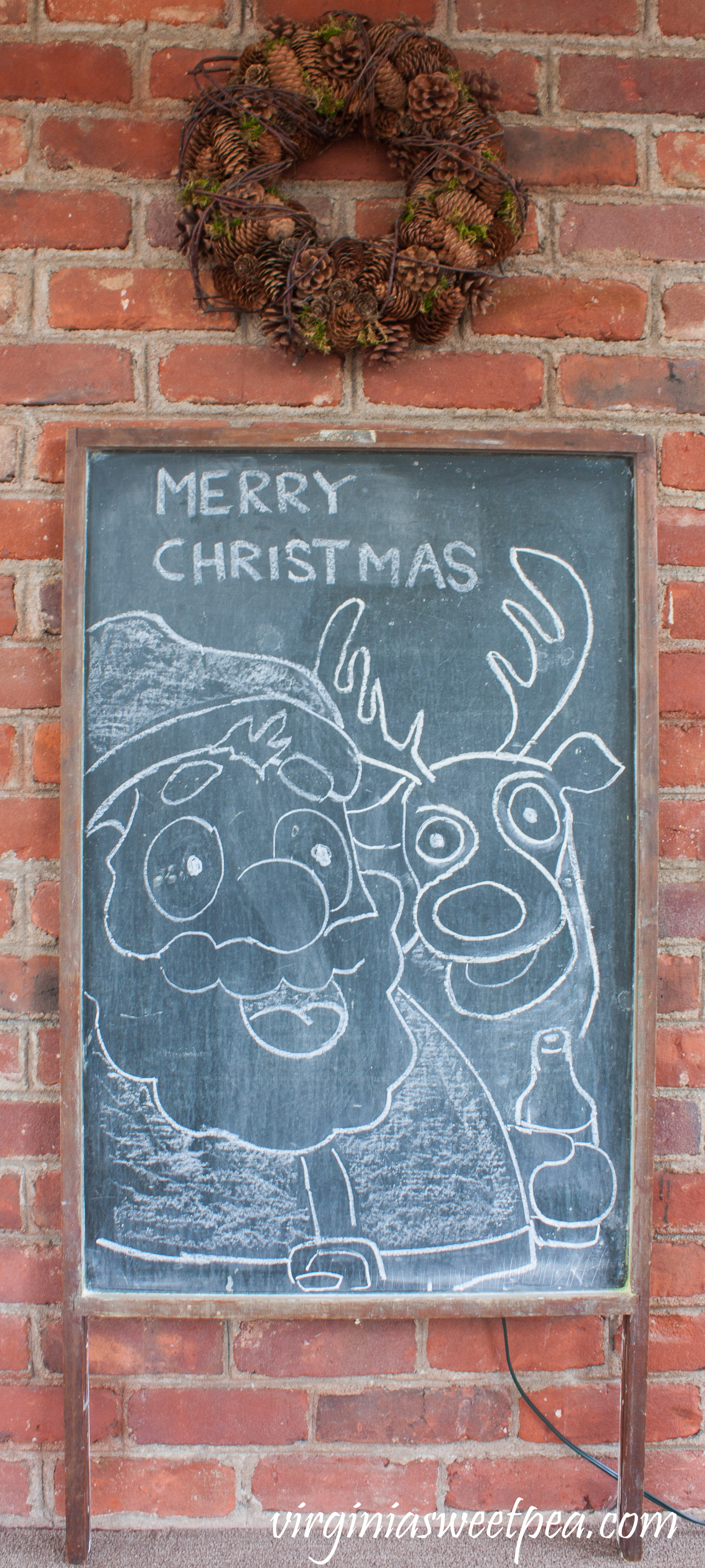 Chalk art featuring Santa enjoying a cold one with Rudolph on an antique chalkboard. #chalkart #christmaschalkart #vintage #christmas