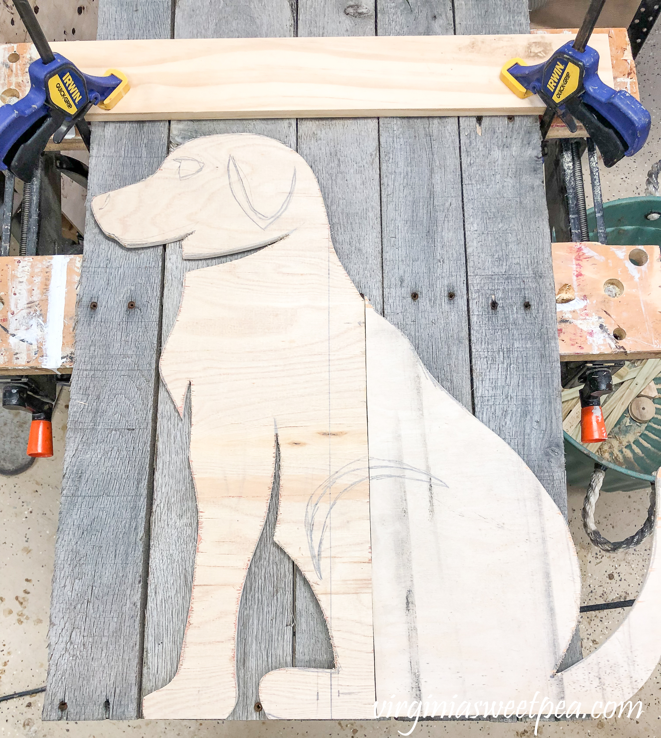 How to Make a Pallet Wood Dog - Silhouette of a dog on pallet wood ready to be cut out. 