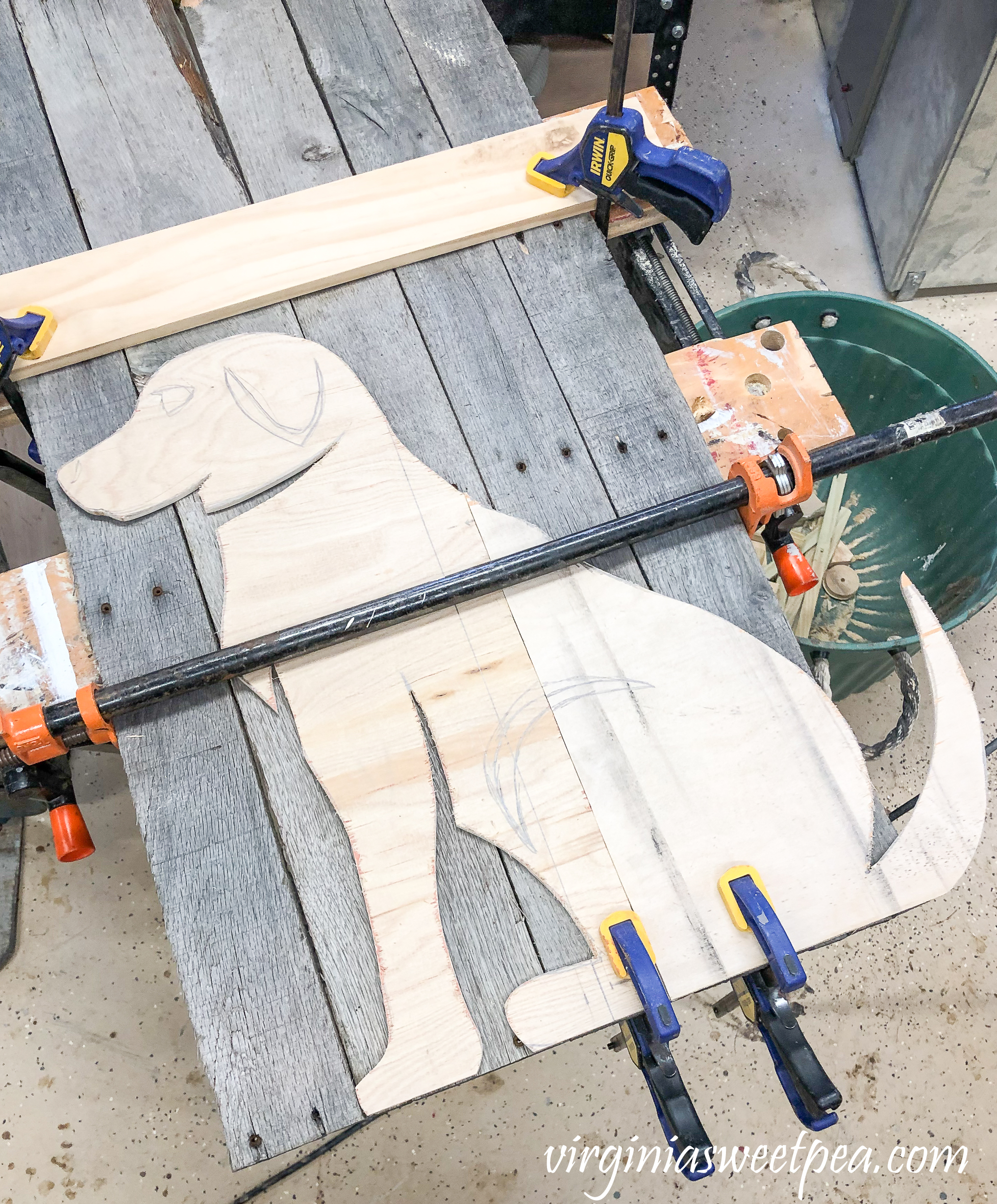 Steps to Make a Pallet Wood Dog - Trace the dog template onto the pallet wood.