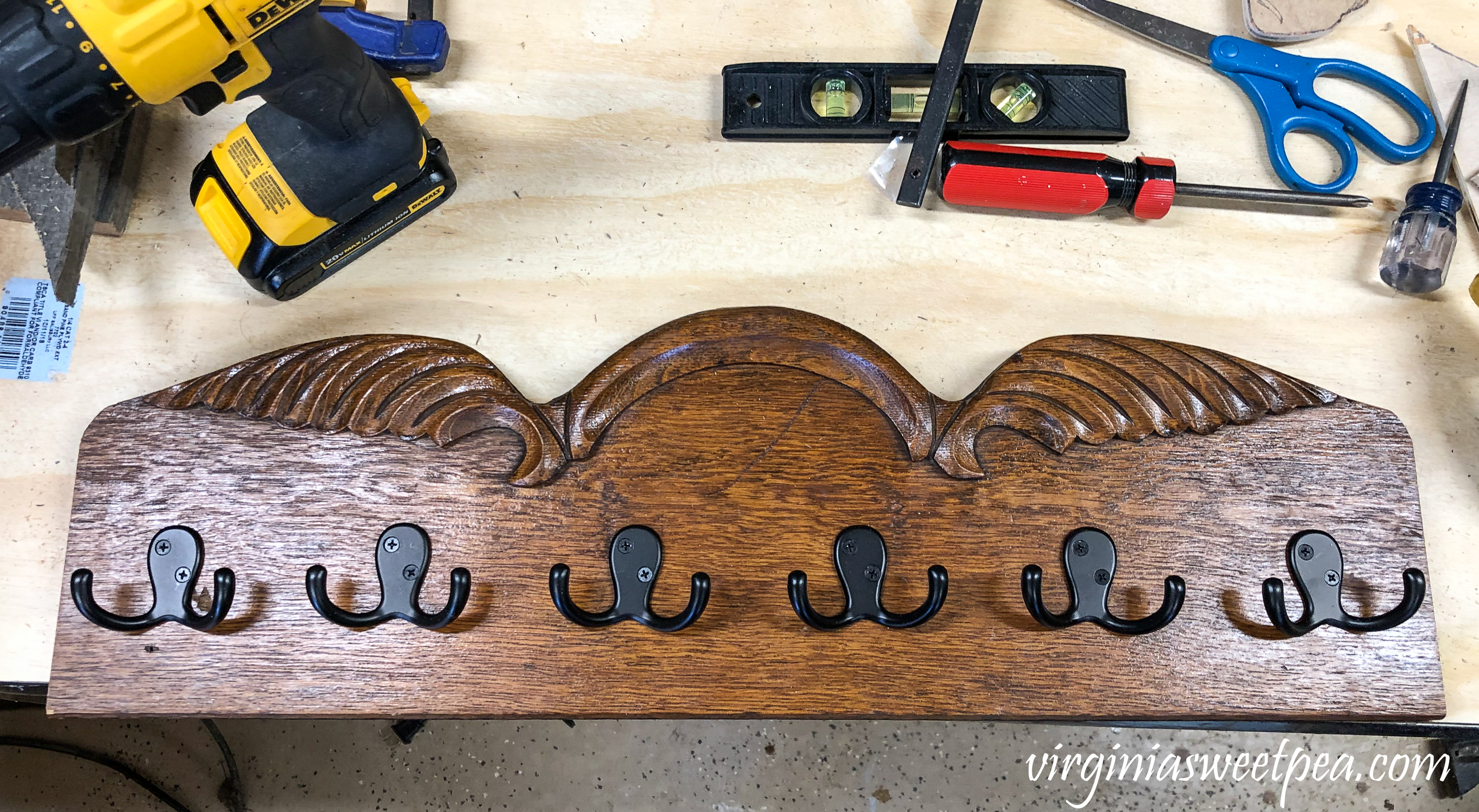 Jewelry organizer with hooks made using an uncycled piece of wood from furniture