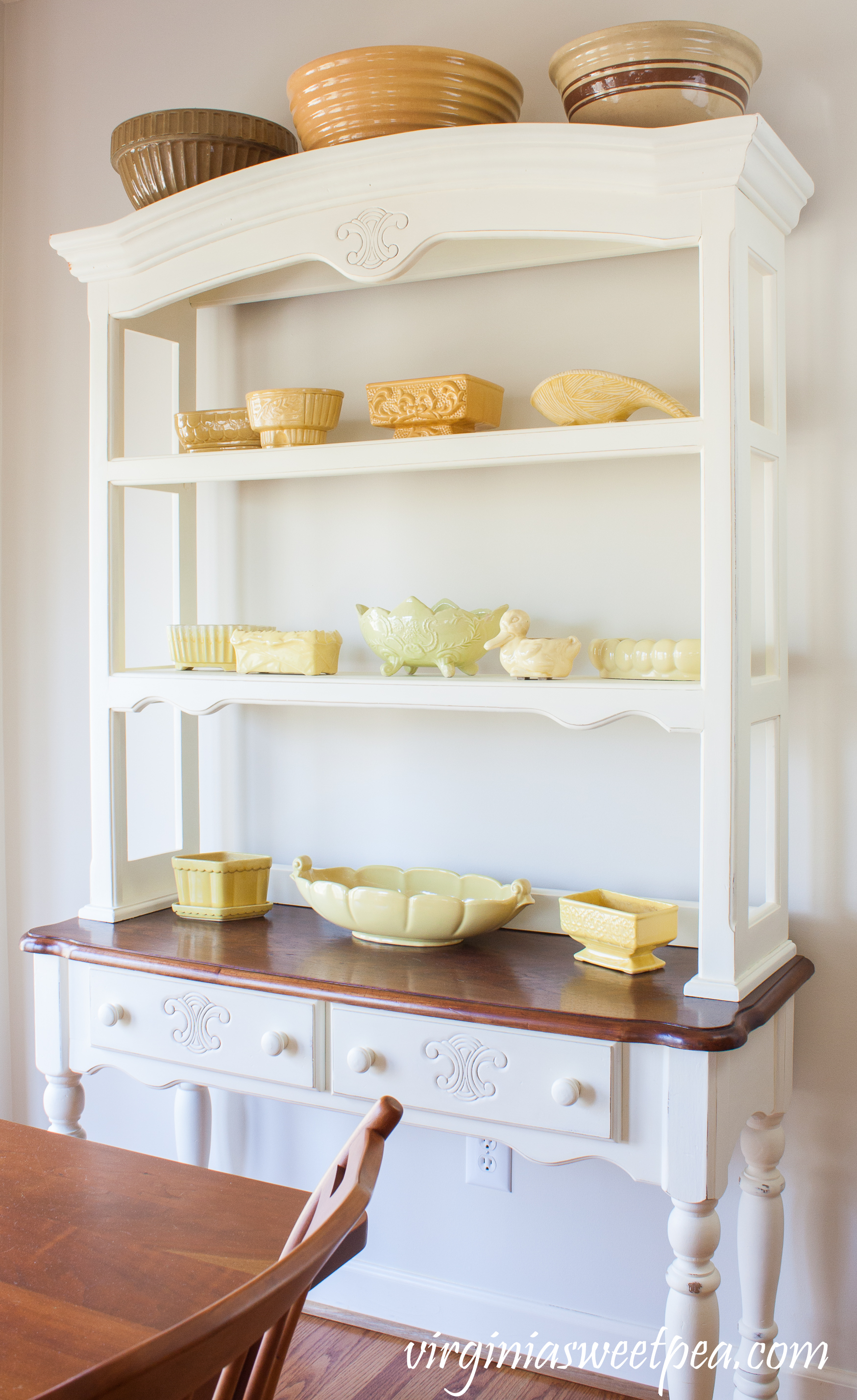 Vintage Yellow Pottery with Vintage Mixing Bowls displayed on a Farmhouse-style Hutch #farmhouse #vintage #vintagepottery #vintageplanters #mccoy #nortonpottery #abingdonpottery #USApottery