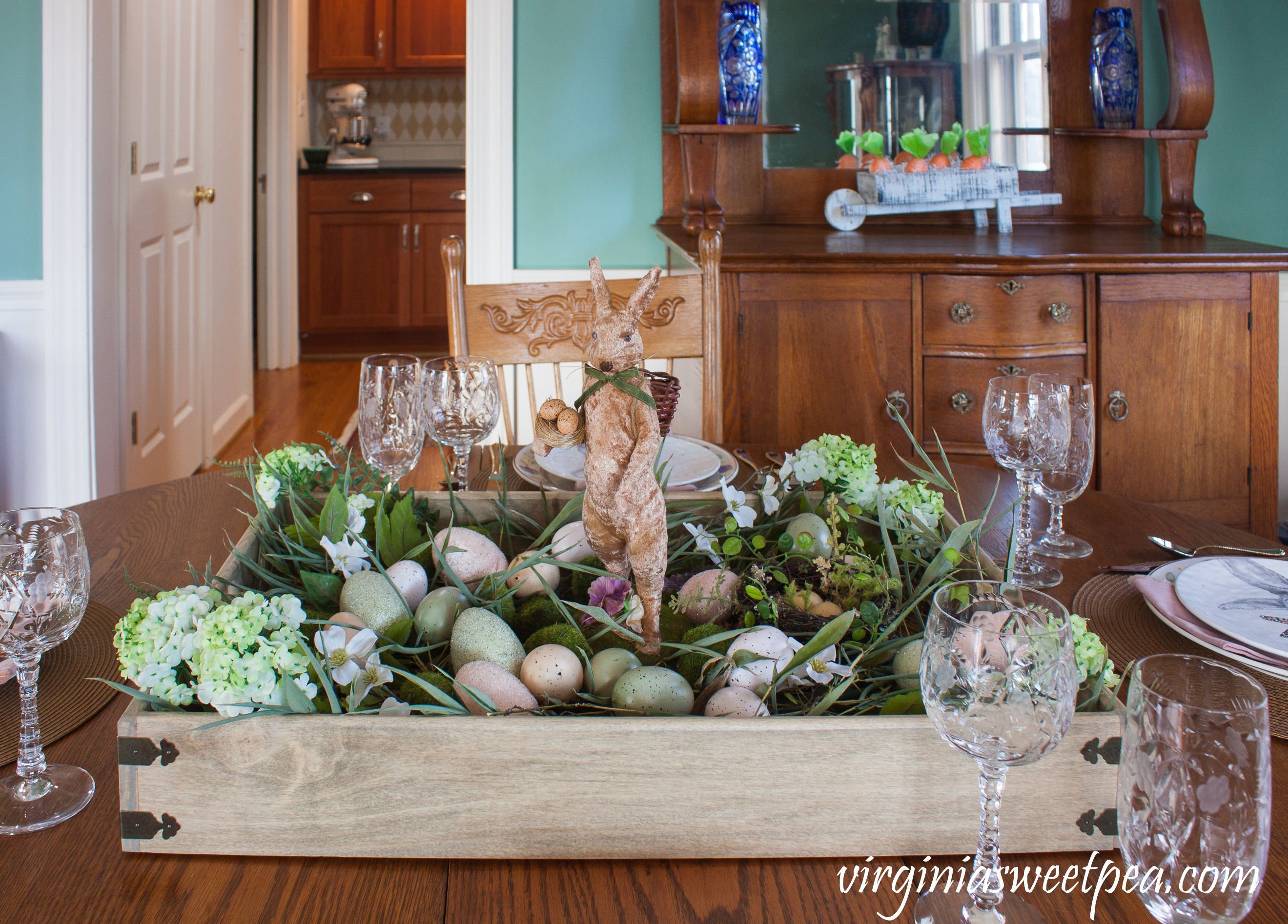 Farmhouse Style Easter Centerpiece with tray, rabbit, grass, eggs, hydrangea